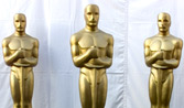 Three of Hugh Jackman's henchmen disguised as Oscars helped rig the balloting backstage (Note: photo nabbed from Oscar's offiicial web site and I'll be damned if they think I'm giving it back.)